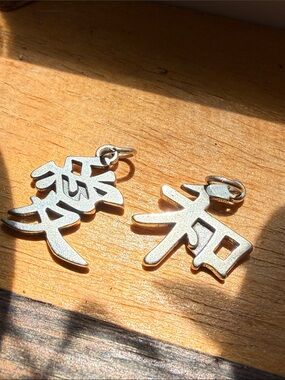 Pair of Silver Character Charm Pendants